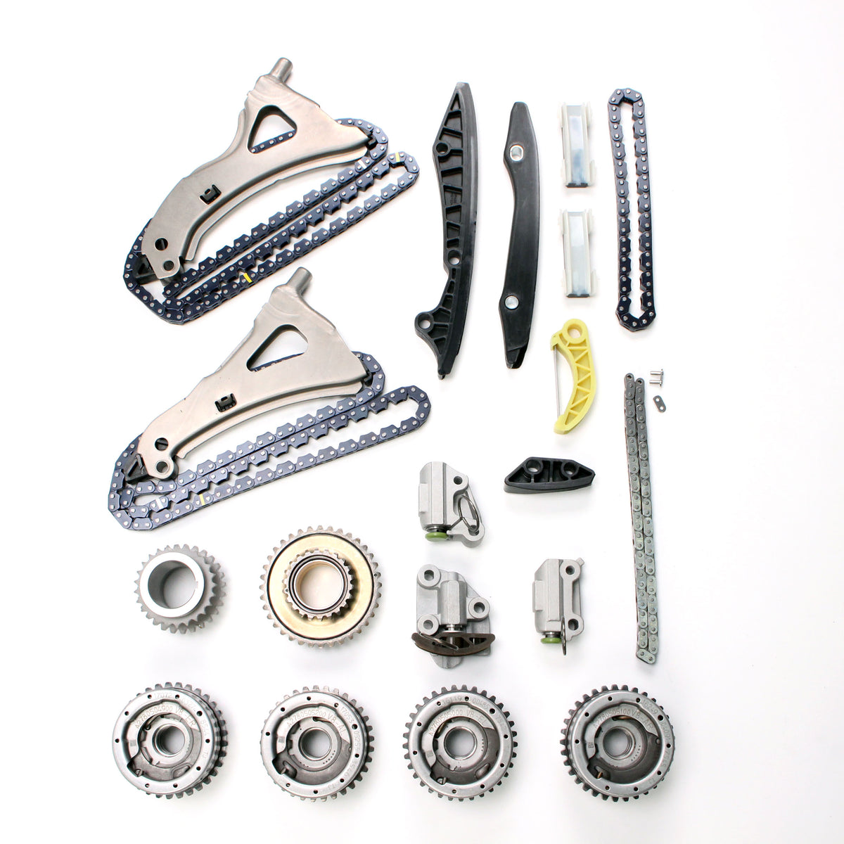 Timing chain kit components assortment with chain guides, gears, and mounting hardware