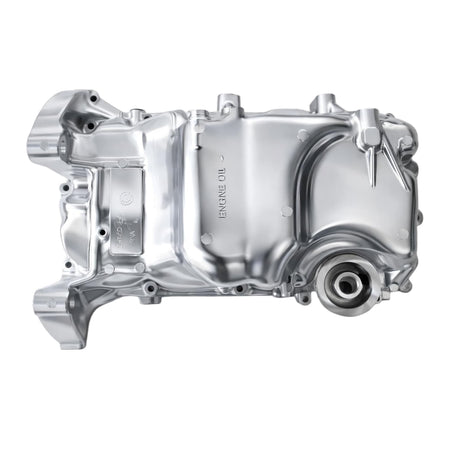 Engine oil pan, silver metal with mounting flanges and oil outlet