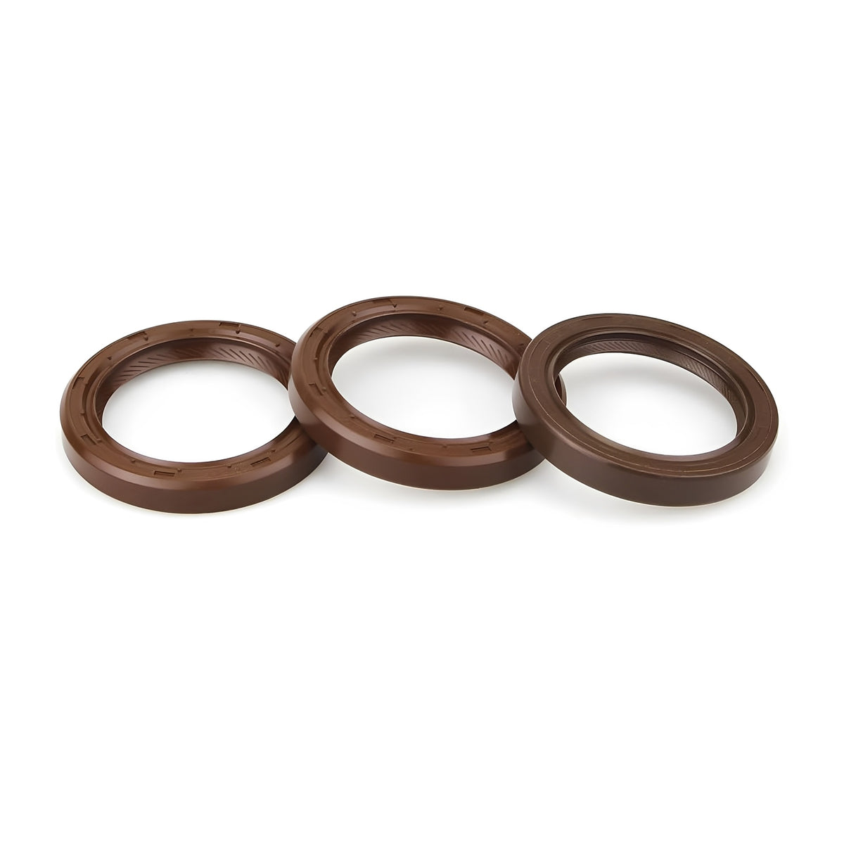 Brown circular camshaft and front crankshaft seals with O-ring gasket edges