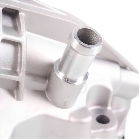 Oil filter housing close-up of silver threaded inlet port