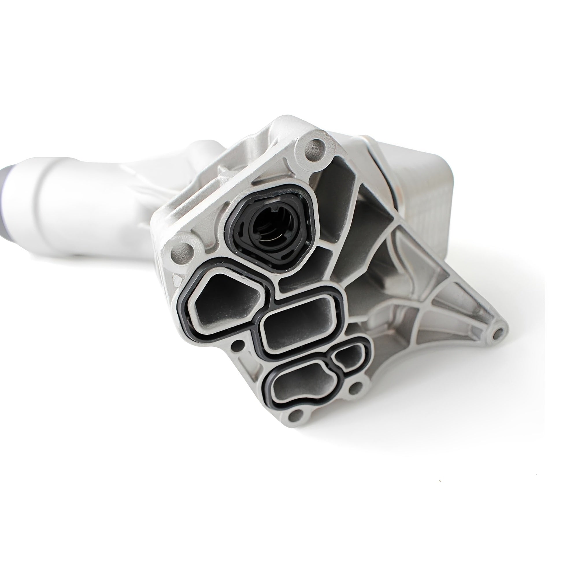 Aluminum oil filter housing with black connector ports and gasket seals