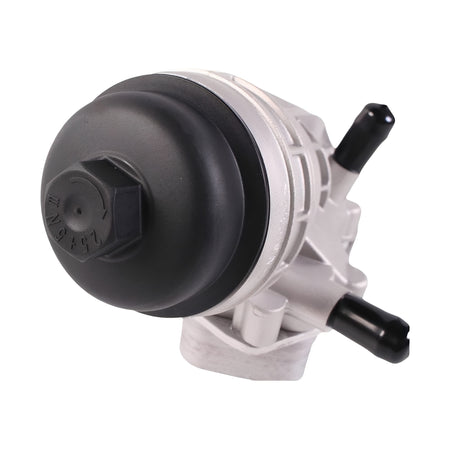 Oil filter housing close-up with large black diaphragm cap and silver body
