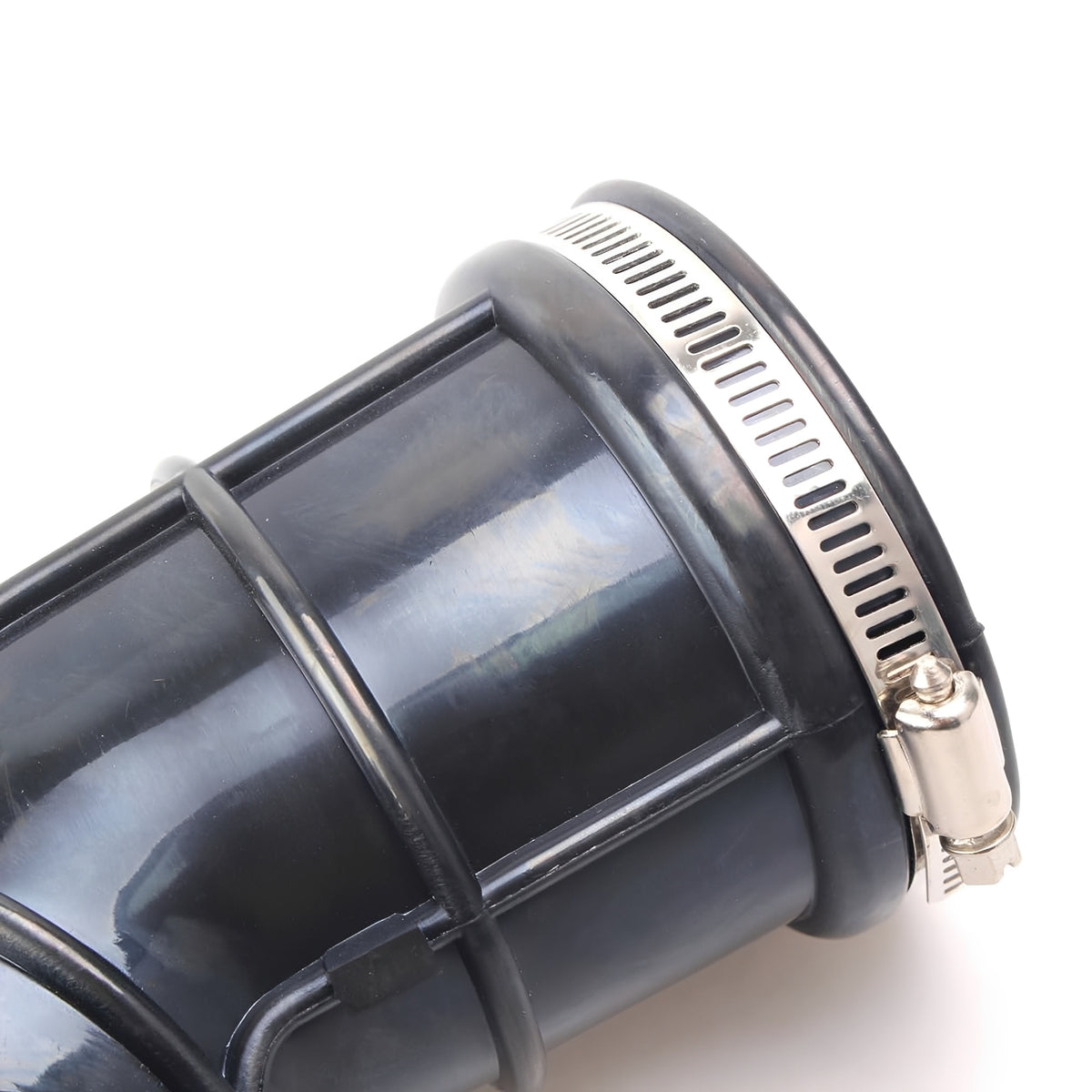 Close-up of black air intake hose with silver metal clamp ring