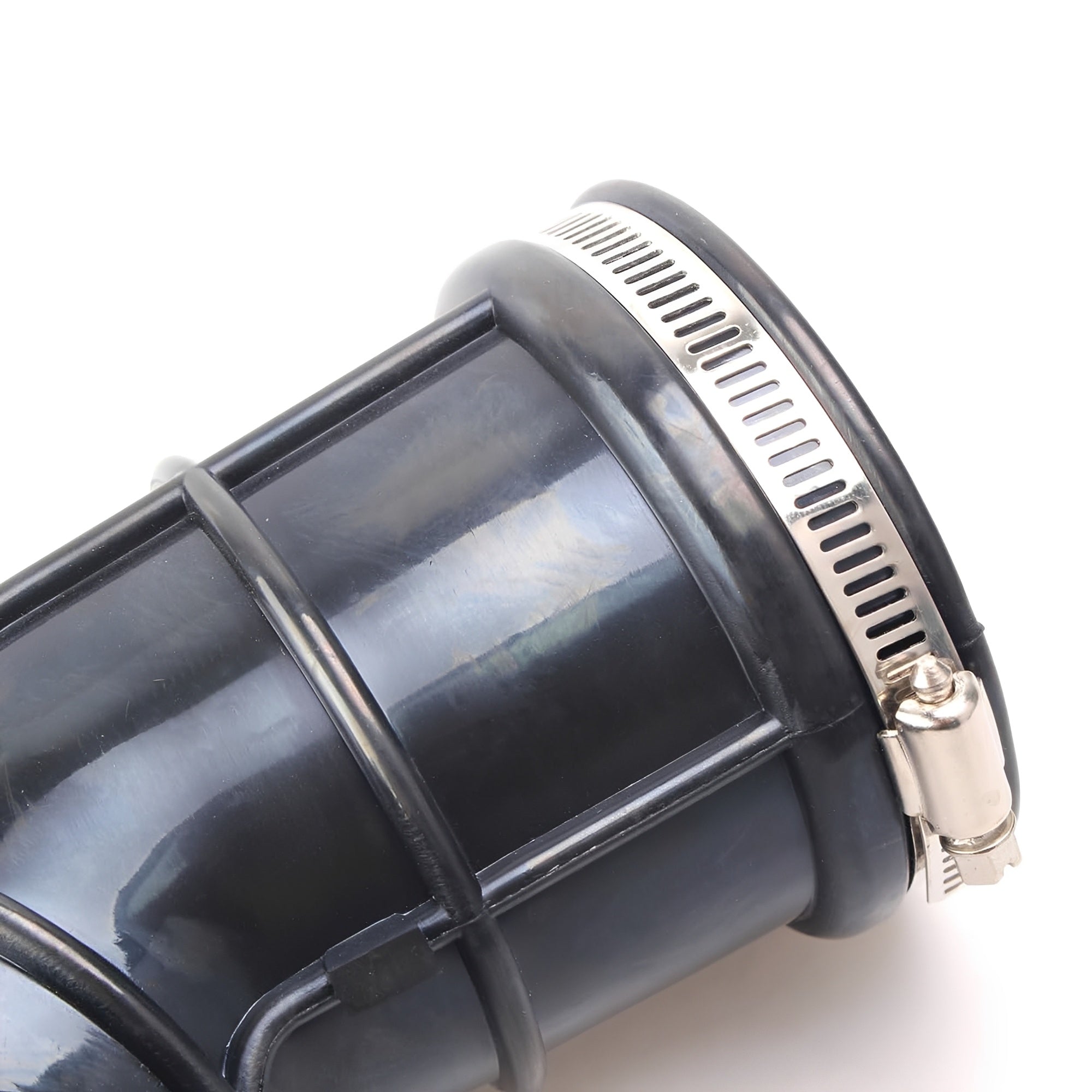 Close-up of black air intake hose with silver metal clamp ring
