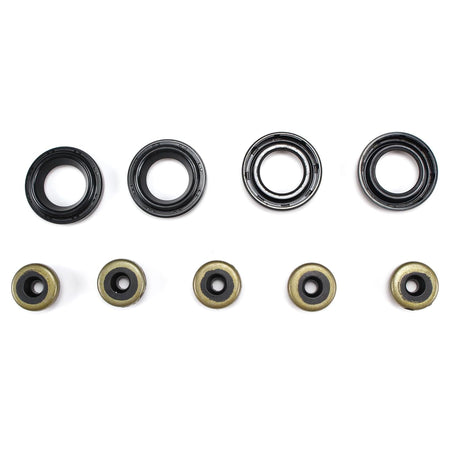 Valve cover gasket set with multiple black seal rings and gold-toned metal washers
