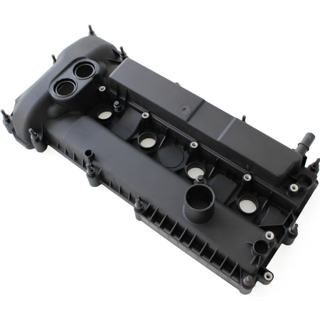 Black engine valve cover with oil cap opening, ports, and mounting hardware