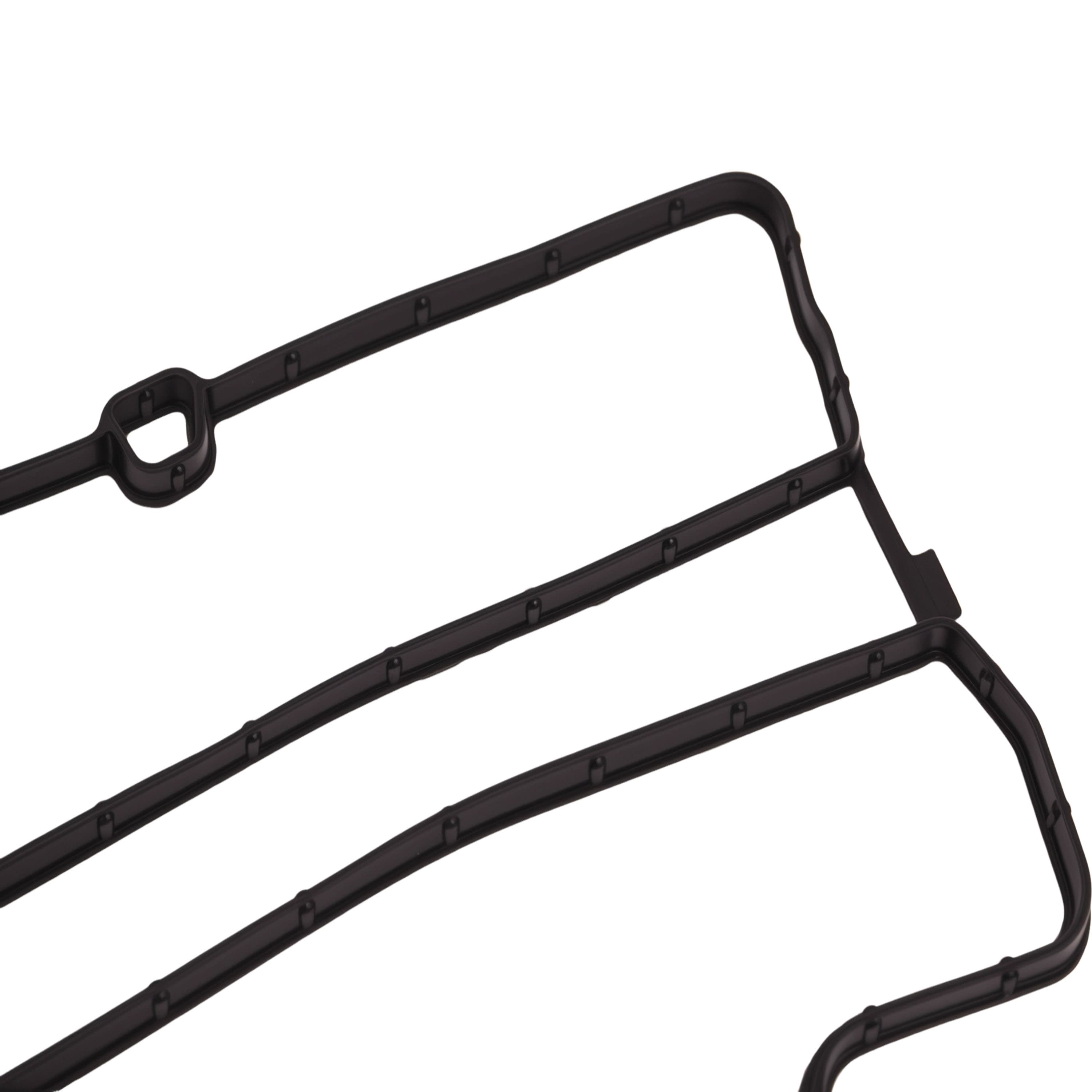 Valve cover gasket seal with molded mounting tabs and channel ridges