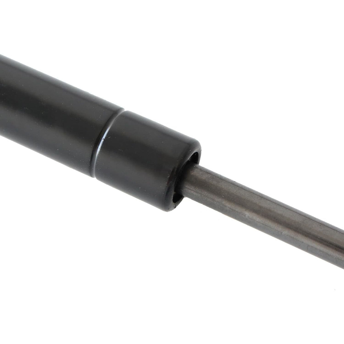 Trunk lift support gas strut with black end bushing and metal piston rod, close-up.