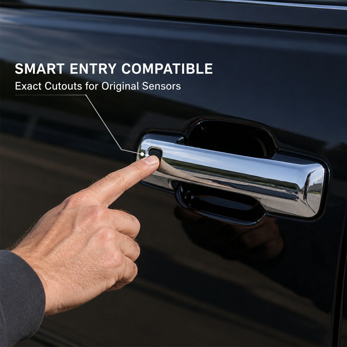 Chrome door handle cover trim with finger pointing on dark vehicle door