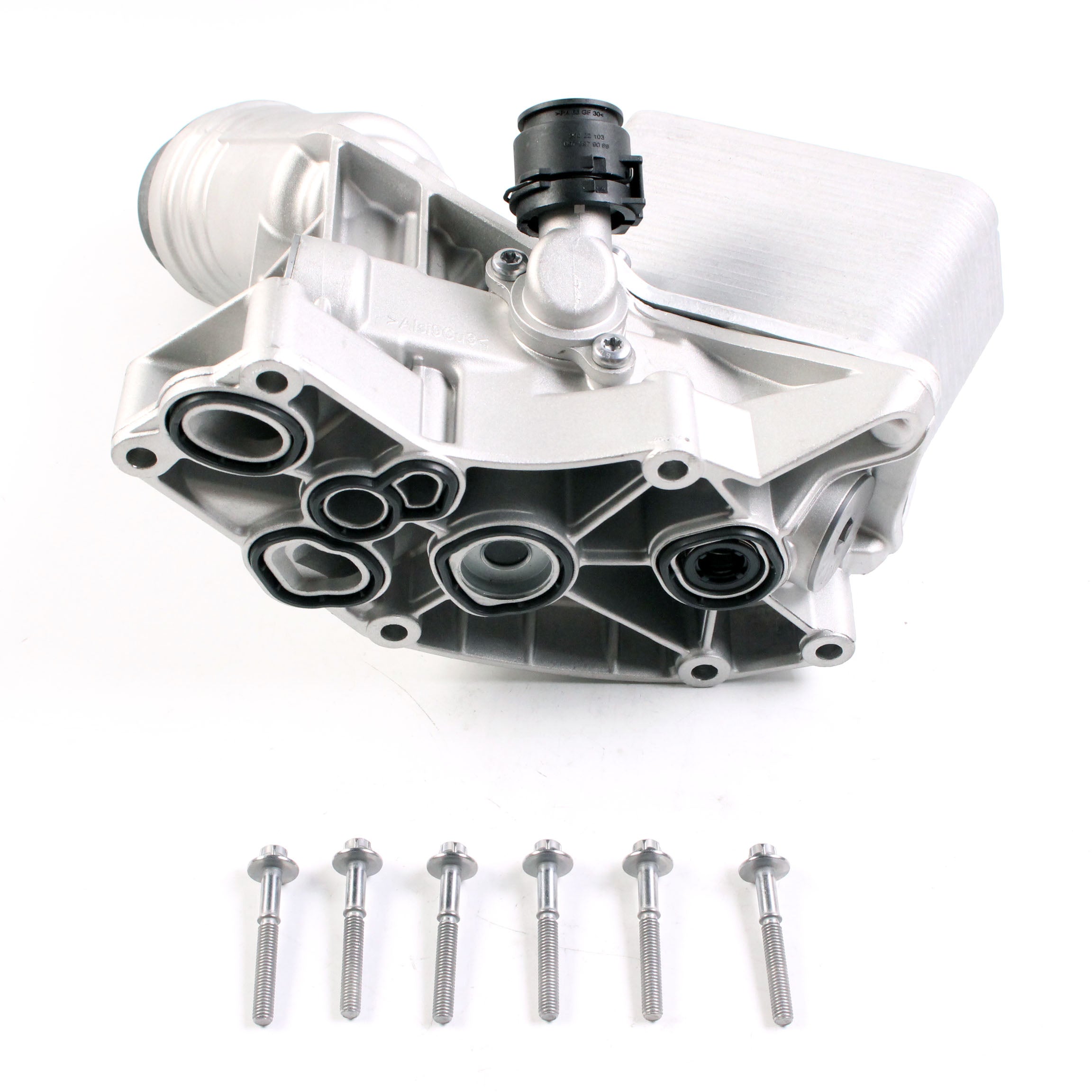 Aluminum engine oil filter housing showing oil ports and included mounting screws