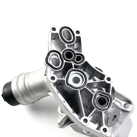 Aluminum engine oil filter housing with circular oil passages and inlet outlet
