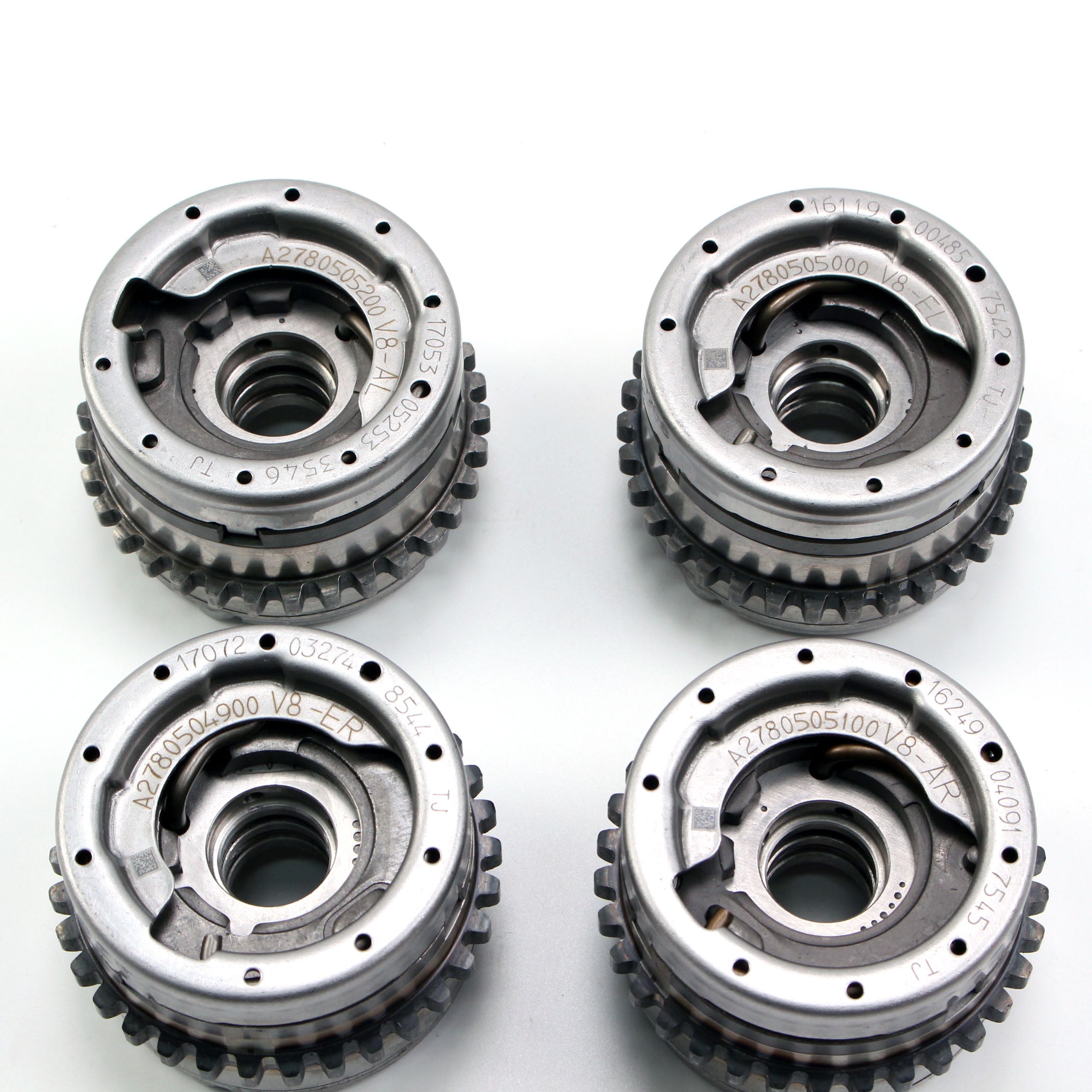 Timing gear sprockets with toothed edges and center holes, silver metal finish