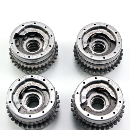 Timing gear sprockets with toothed edges and center holes, silver metal finish