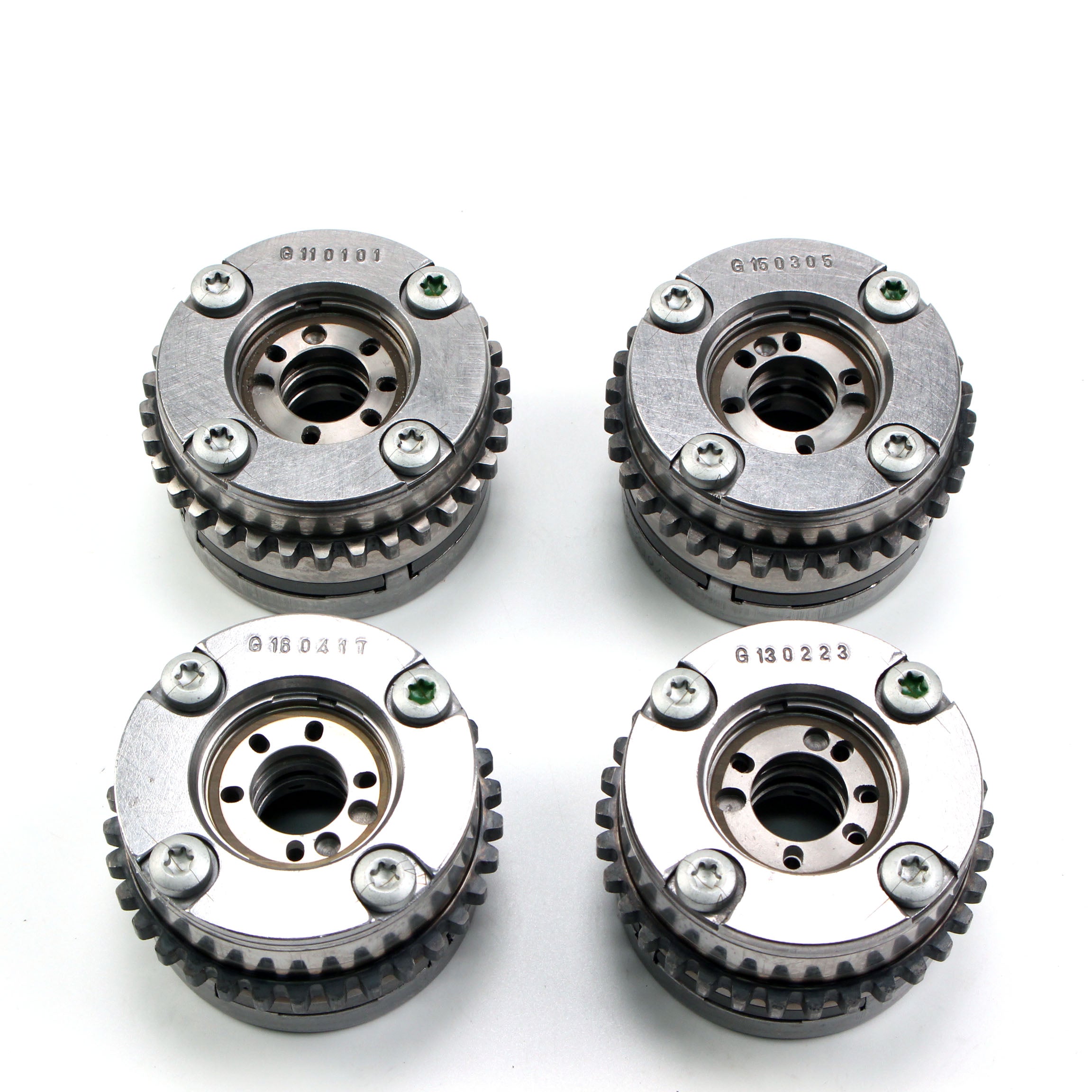 Timing gear sprockets with bolt heads and toothed rings, silver metal