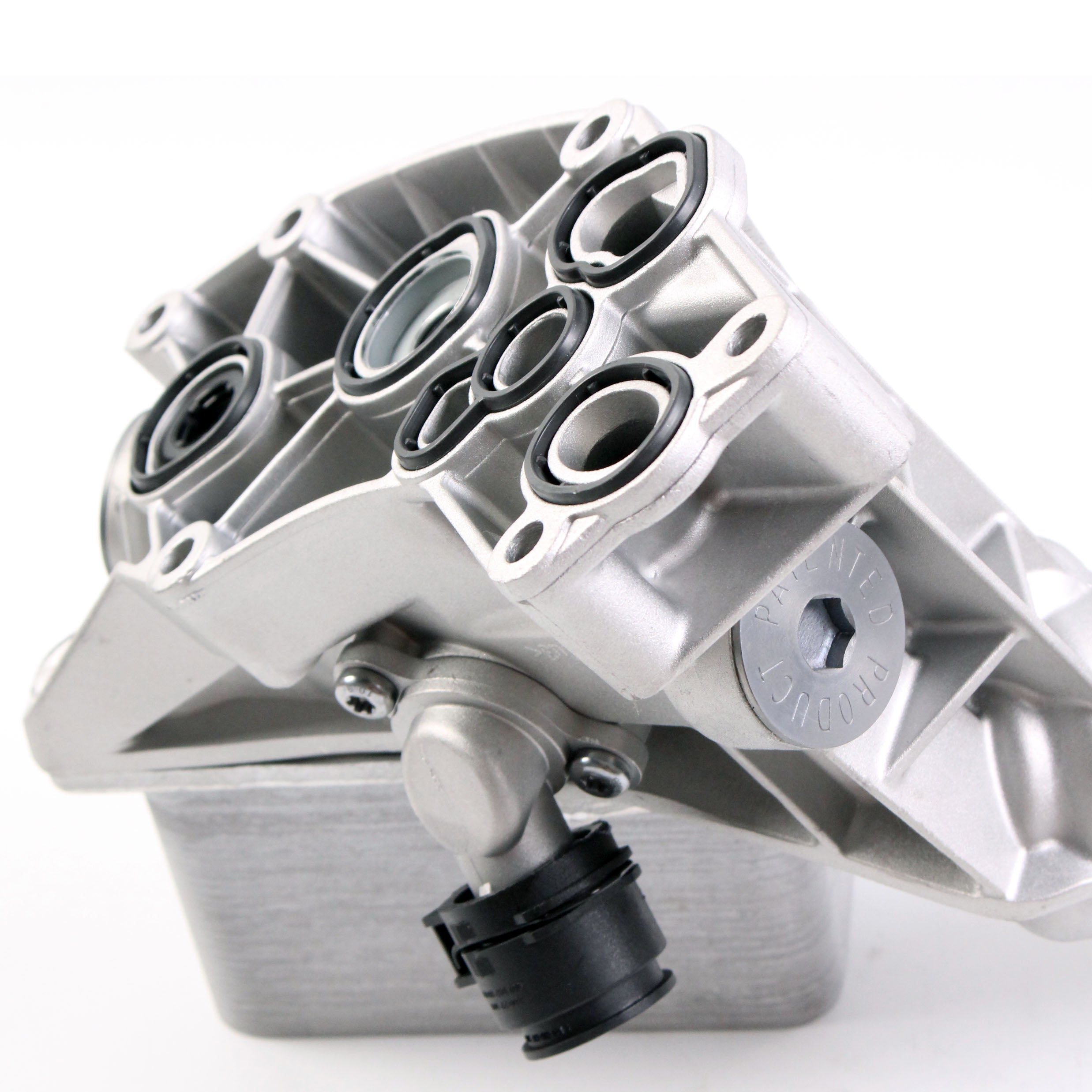 Aluminum engine oil filter housing with machined ports and gasket face