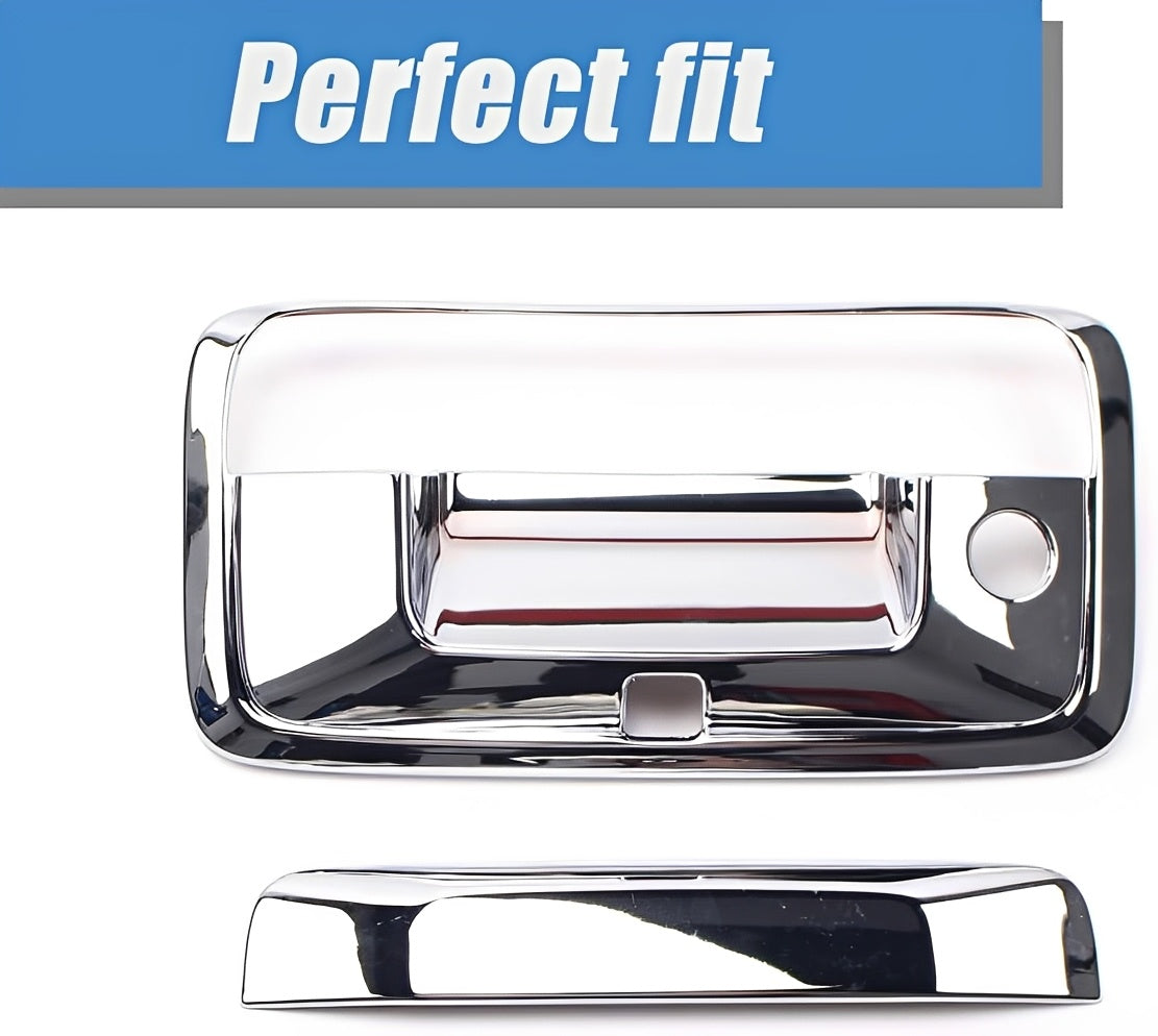 Chrome tailgate handle cover with recessed opening and round side hole.