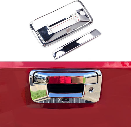 Chrome tailgate handle cover set with trim piece and backing plate, angled view.
