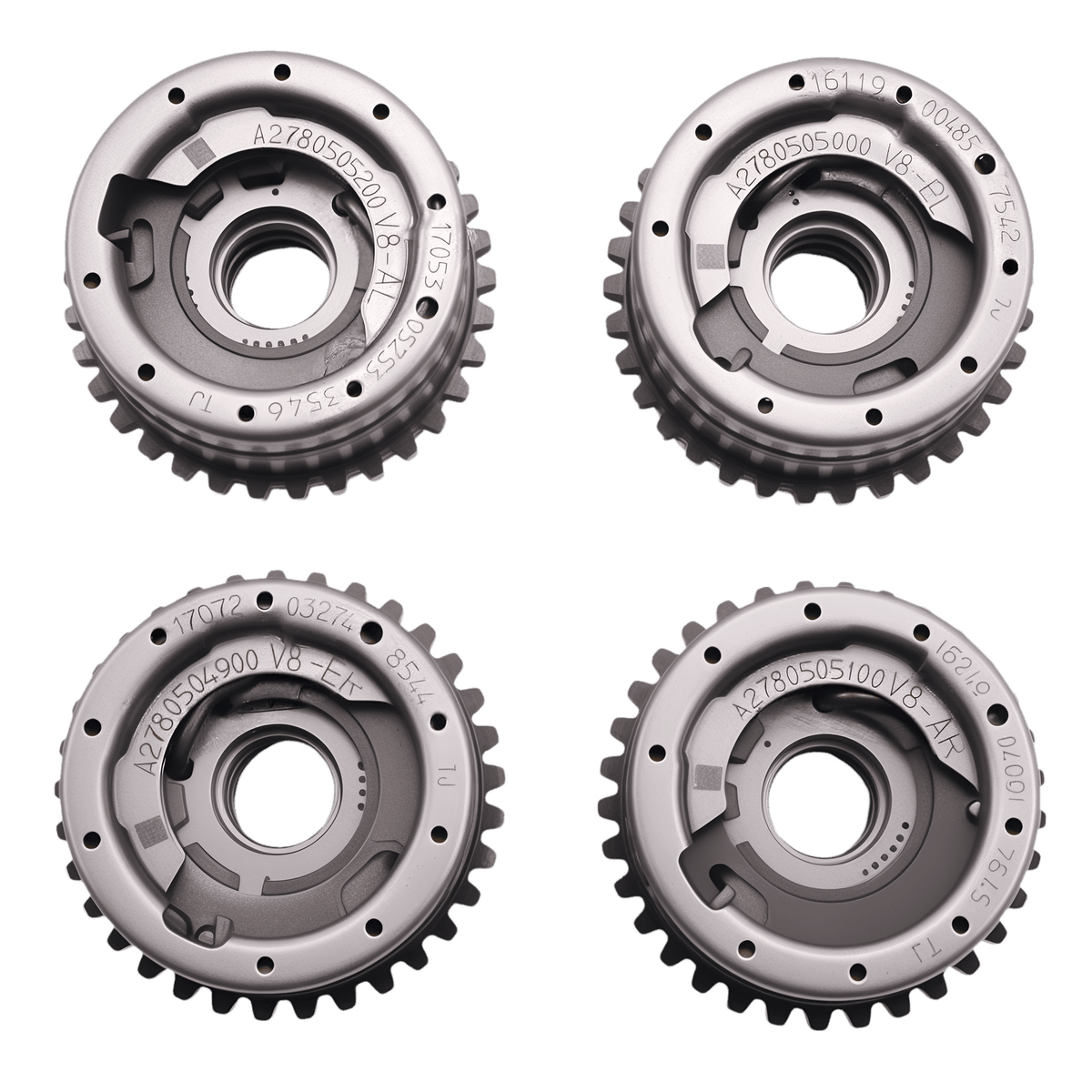 Four steel timing sprocket gears with central ring and toothed edges