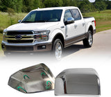 Polished chrome mirror covers shown near a white pickup’s side mirrors